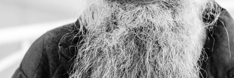 grayscale photo of man in black jacket