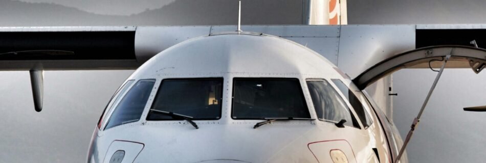 people walking on the side of the airplane under white clouds during daytime